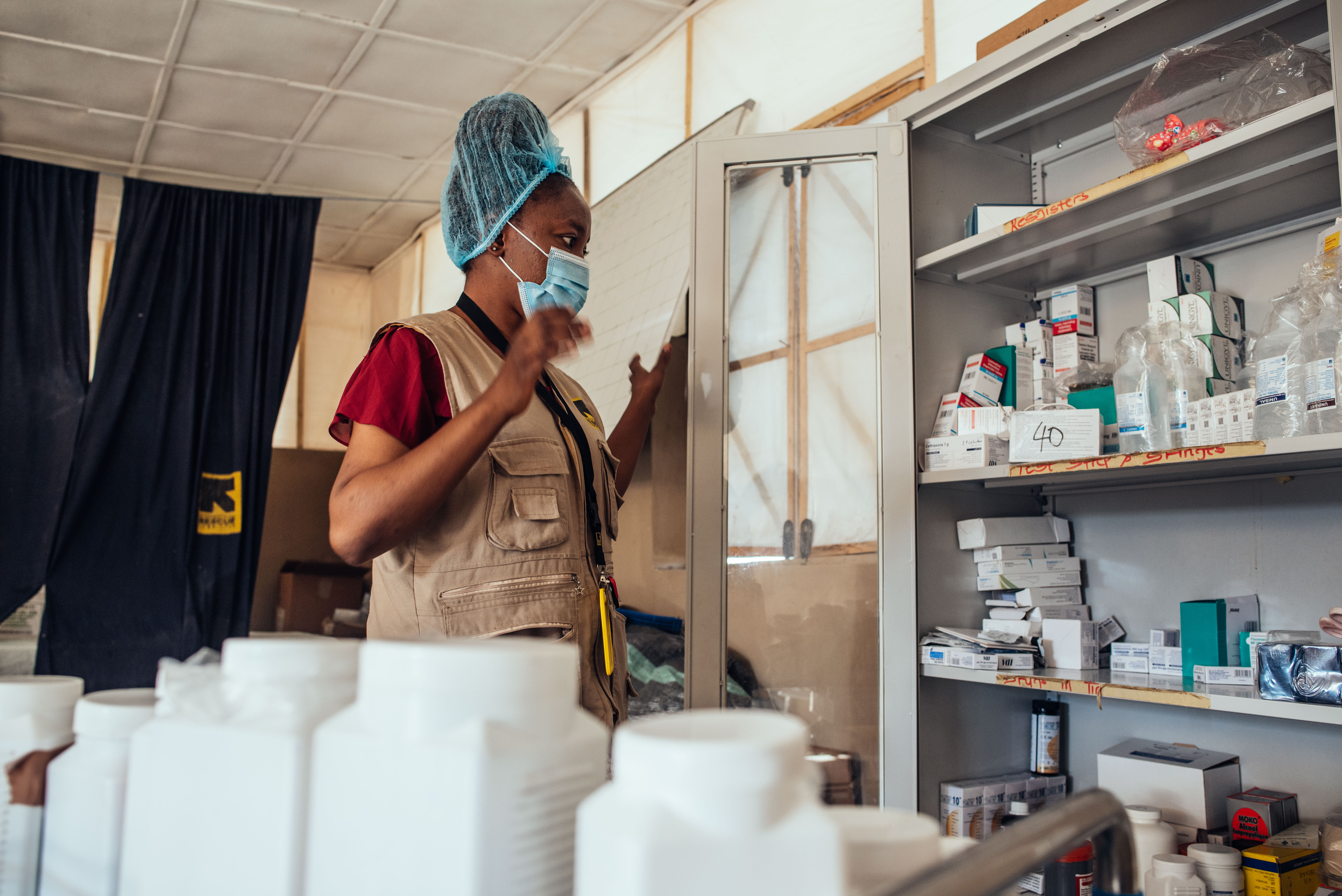 Murna Gyang Tok, IRC midwife staff, takes stock of drugs and medications available at IRC health facility in Nigeria.